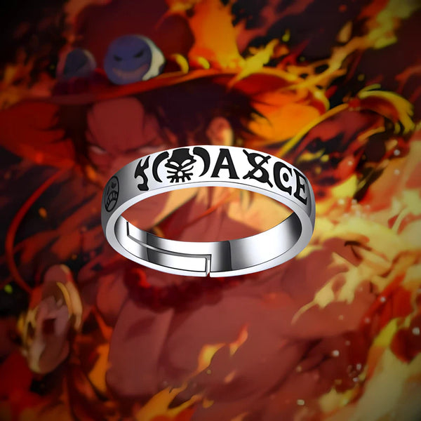 Bague ACE posée sur fond enflammé, hommage à Portgas D. Ace