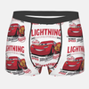 Boxer blanc pour enfant avec un motif de Lightning McQueen et l'inscription "Lightning", avec une ceinture élastique noire.