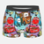 Boxer pour enfant avec un motif "all-over" coloré de tous les personnages de Cars, y compris Flash McQueen, Martin, Luigi et Guido.