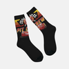 Paire de chaussettes noires montantes ("crew socks") avec un design de Flash McQueen, le logo "Pit Crew" et un drapeau à damier.