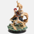 Figurine de Gaara en Kazekage (23cm), vue de face, en posture de combat sur un tourbillon de sable, avec la griffe de Shukaku se formant à ses côtés.