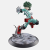 Figurine de Izuku Midoriya (Deku) de My Hero Academia, en pose d'atterrissage sur un sol rocheux qui explose, avec une expression de combat intense.