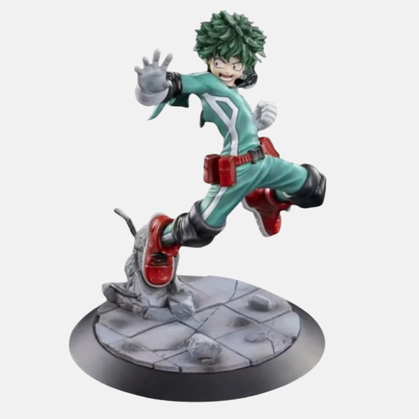 Figurine de Izuku Midoriya (Deku) de My Hero Academia, en pose d'atterrissage sur un sol rocheux qui explose, avec une expression de combat intense.