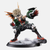 Figurine de Katsuki Bakugo de My Hero Academia dans son costume d'hiver, en position accroupie, prêt à bondir en avant.