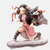 Figurine de Nezuko Kamado de Demon Slayer en pose de combat dynamique, prête à donner un coup de pied.