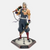 Figurine de Uzui Tengen, le Pilier du Son de Demon Slayer, dans une pose de combat dynamique avec ses doubles lames.