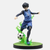 Figurine de Yoichi Isagi de Blue Lock en vue de trois-quarts, en pose de "Direct Shot", entouré d'une aura verte en forme de pièces de puzzle.