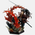 Figurine de Yoriichi Tsugikuni de Demon Slayer exécutant le Souffle du Soleil, entouré d'un dragon de feu.