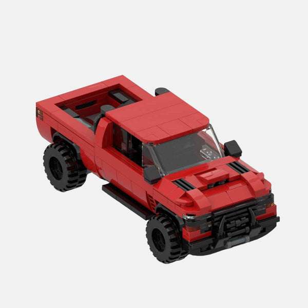 Vue de profil du Dodge Ram 1500 TRX en briques, montrant sa longueur et sa garde au sol.