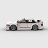 Vue de profil de la Nissan Silvia S14 en briques, montrant la longueur et les détails du modèle.