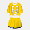Ensemble pyjama femme My Hero Academia : crop top jaune avec logo "FG" noir et short noir assorti, inspiré de Fat Gum.