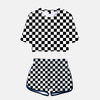 Ensemble pyjama femme Demon Slayer composé d'un crop top et d'un short assorti, arborant un motif à carreaux (damier) noir et blanc.