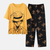 Ensemble pyjama adulte One Piece : chemise manches longues jaune avec portrait de Luffy, pantalon long noir à motifs Jolly Roger/symboles.