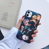 Vue de face de la coque de l'équipe de Tanjiro, montrant l'artwork dynamique des personnages de Demon Slayer.