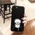 Coque noire pour iPhone avec le design de l'œil Rinnegan de Pain, de l'anime Naruto Shippuden, tenue en main.