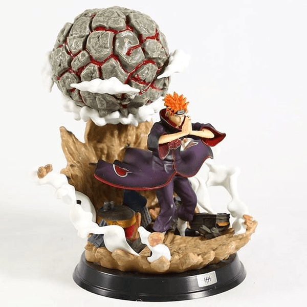figurine dynamique avec détails dorés et sphère noire suspendue