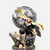 Figurine de Gyomei Himejima, le Pilier de la Roche de Demon Slayer, dans une pose de combat, maniant son fléau et sa hache.