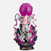 Figurine de Kid Buu (Majin Blast) 25cm, entouré d'une aura de Ki rose, pose d'attaque, vue de face.