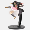 Figurine de Nezuko Kamado de Demon Slayer en pleine course, avec ses cheveux et son kimono au vent.
