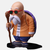 Figurine de Roshi (Kame Sennin) de Dragon Ball Z, assis dans sa tenue orange et pantalon bleu, vue de face.