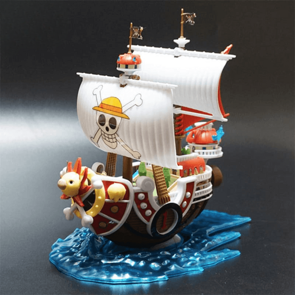 navire des Mugiwara One Piece, voiles blanches et lion doré
