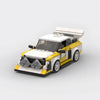 Kit de construction d'une Audi Sport Quattro S1 en briques, montrant la livrée de rallye jaune et blanche.
