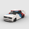 Kit de construction d'une BMW M3 E30 Motorsport en briques, montrant la livrée de course et la vue de trois-quarts avant.