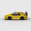 Kit de construction d'une BMW M3 E36 jaune en briques, montrant la vue de trois-quarts avant.