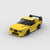 Kit de construction d'une BMW M3 E36 jaune en briques, montrant la vue de trois-quarts avant.
