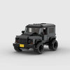 Kit de construction d'un Land Rover Defender gris en briques, montrant la vue de trois-quarts avant.