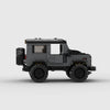 Vue de profil du Land Rover Defender en briques, montrant sa longueur et ses détails.