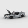 Vue de face de la Nissan Silvia S14 en briques, montrant la calandre et les phares emblématiques.