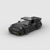 Kit de construction d'une Porsche 911 Turbo "Blackbird" noire en briques, montrant la vue de trois-quarts avant.