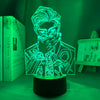 Lampe Kento Nanami allumée en vert, posée sur un bureau